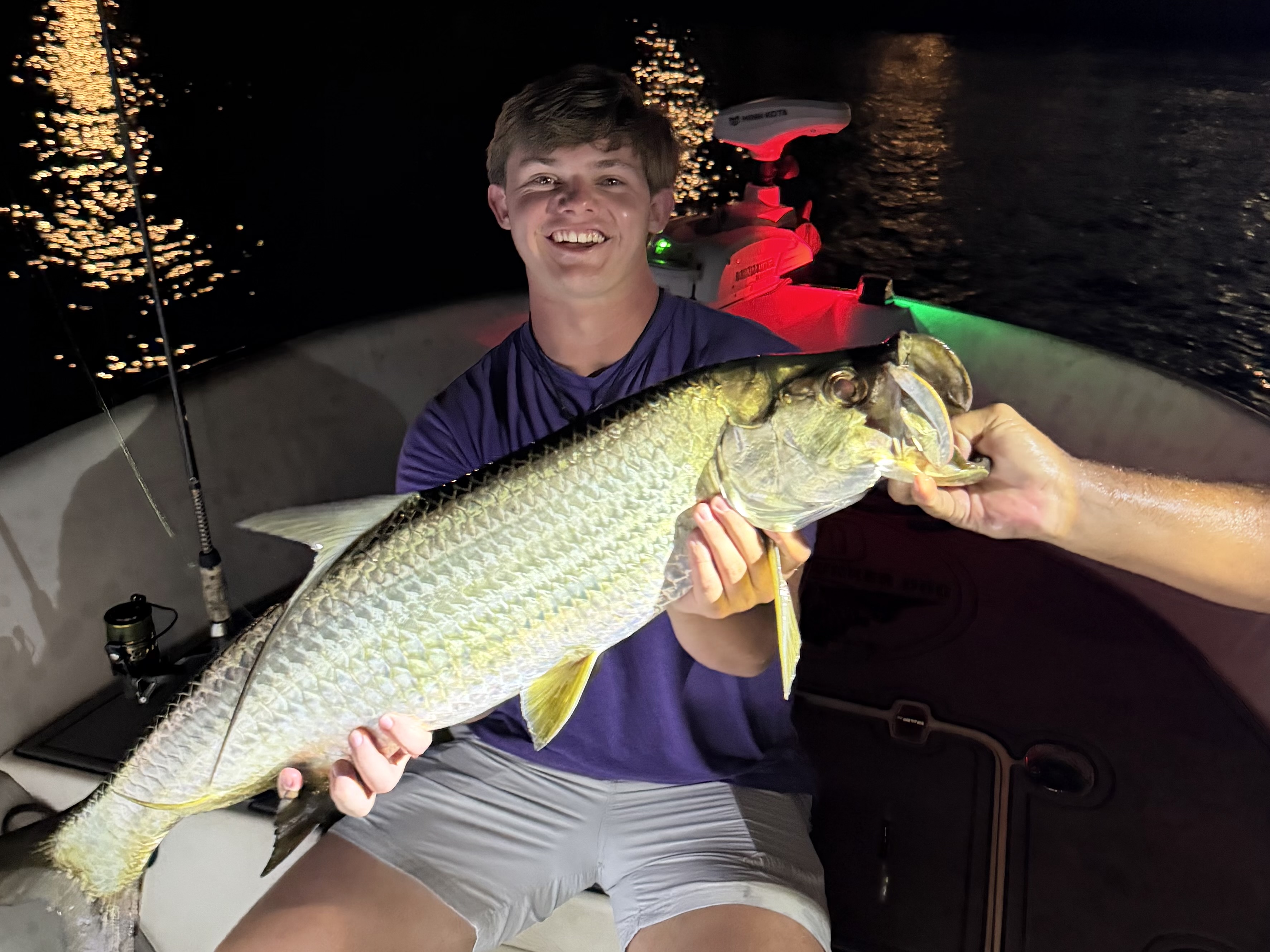 Hayes holding his first tarpon caught on a Fort Lauderdale fishing charter with Captain Jeff Maggio.